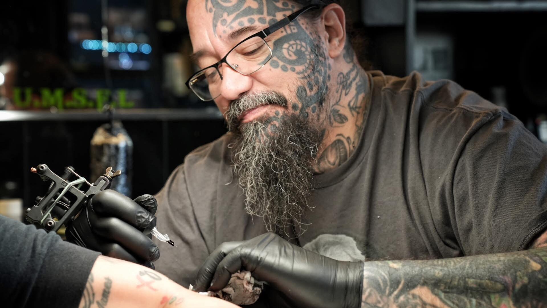 Tattoo artist portrait inside a studio